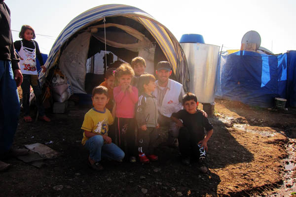 With refugee children in Domiz Refugee Camp for Syrians, Iraq